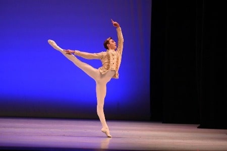 He si dancing in a stage.